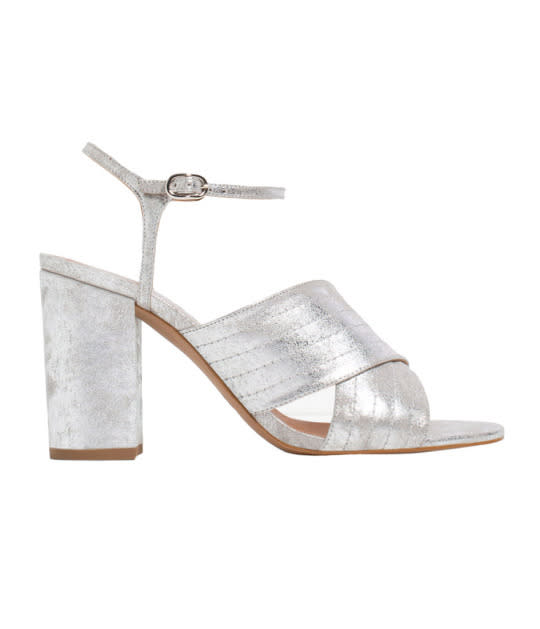 <p>Metalic Crossover Sandals, $70,<a href="http://www.zara.com/us/en/woman/shoes/heeled-sandals/metallic-crossover-sandals-c358014p3536501.html" rel="nofollow noopener" target="_blank" data-ylk="slk:Zara;elm:context_link;itc:0;sec:content-canvas" class="link "> Zara</a></p>