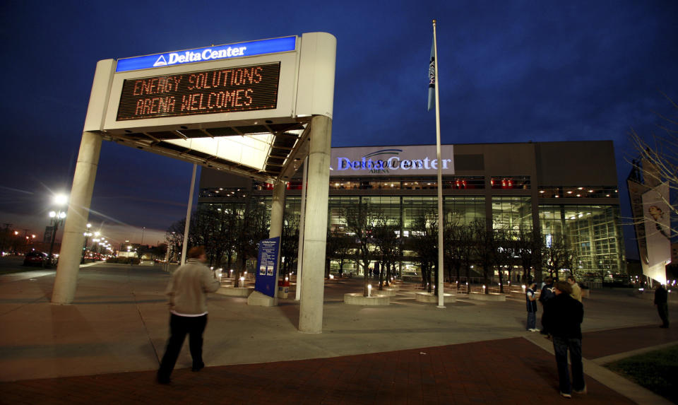 FILE - The marquee in front of the Energy Solutions Arena, formerly the Delta Center and home of the Utah Jazz, NBA basketball team, shows conflicting signage at dusk before a game against the Toronto Raptors Monday, Nov. 20, 2006, in Salt Lake City. The owners of the NBA’s Utah Jazz said Wednesday, Jan. 24, 2024, they have the immediate ability to bring an NHL team to Salt Lake City and requested the initiation of an expansion process. (AP Photo/Steve C. Wilson, File)