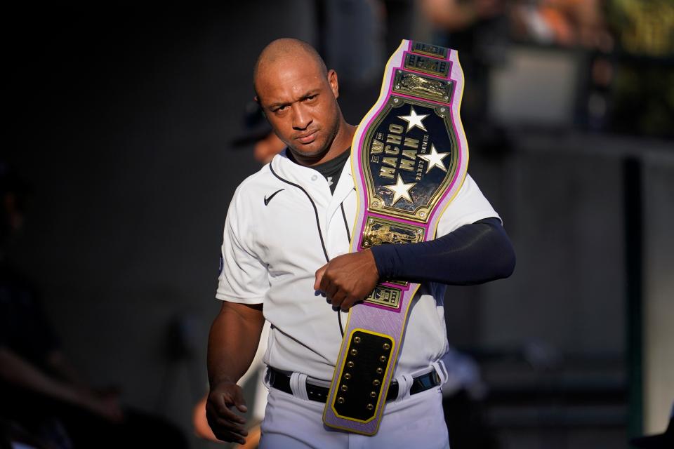 Detroit Tigers' Jonathan Schoop carries a belt in the dugout before a game against the Texas Rangers at Comerica Park in Detroit on Friday, June 17, 2022.