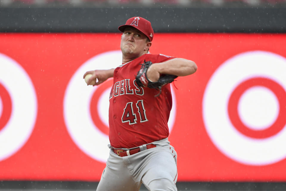 Los Angeles Angels pitcher Andrew Wantz throws against the Minnesota Twins as the rain begins, causing a delay, during the sixth inning of a baseball game Sunday, Sept. 24, 2023, in Minneapolis. (AP Photo/Craig Lassig)