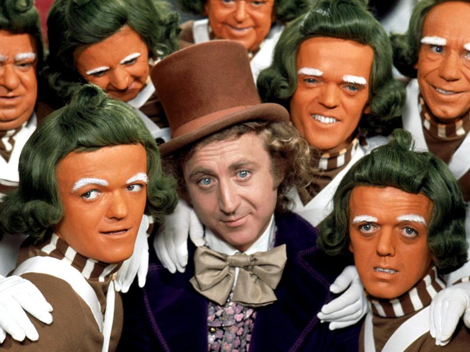 Gene Wilder in the original surrounded by Oompa Loompas