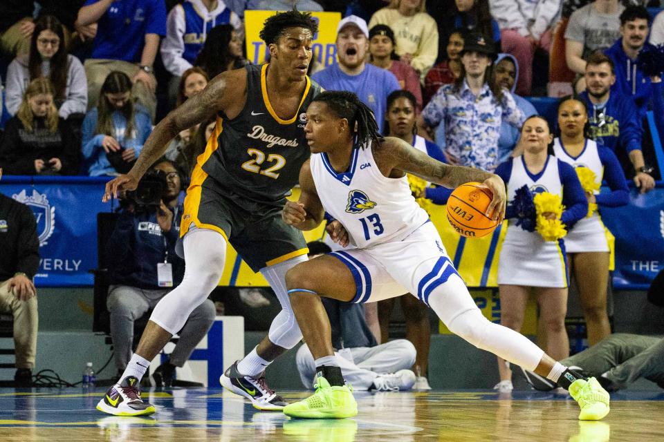 Drexel forward Amari Williams (22) defends Delaware forward Jy'are Davis (13) in a game at the Bob Carpenter Center on Feb. 26. Williams committed to Kentucky on April 21.