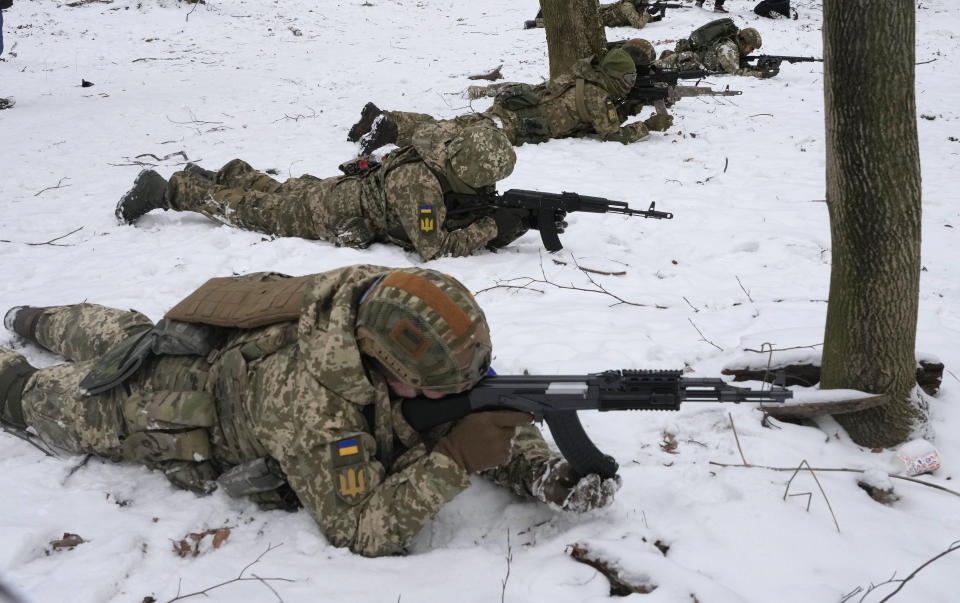 Members of Ukraine's Territorial Defense Forces, volunteer military units of the Armed Forces, train in a city park in Kyiv, Ukraine, Saturday, Jan. 22, 2022. Dozens of civilians have been joining Ukraine's army reserves in recent weeks amid fears about Russian invasion. (AP Photo/Efrem Lukatsky)