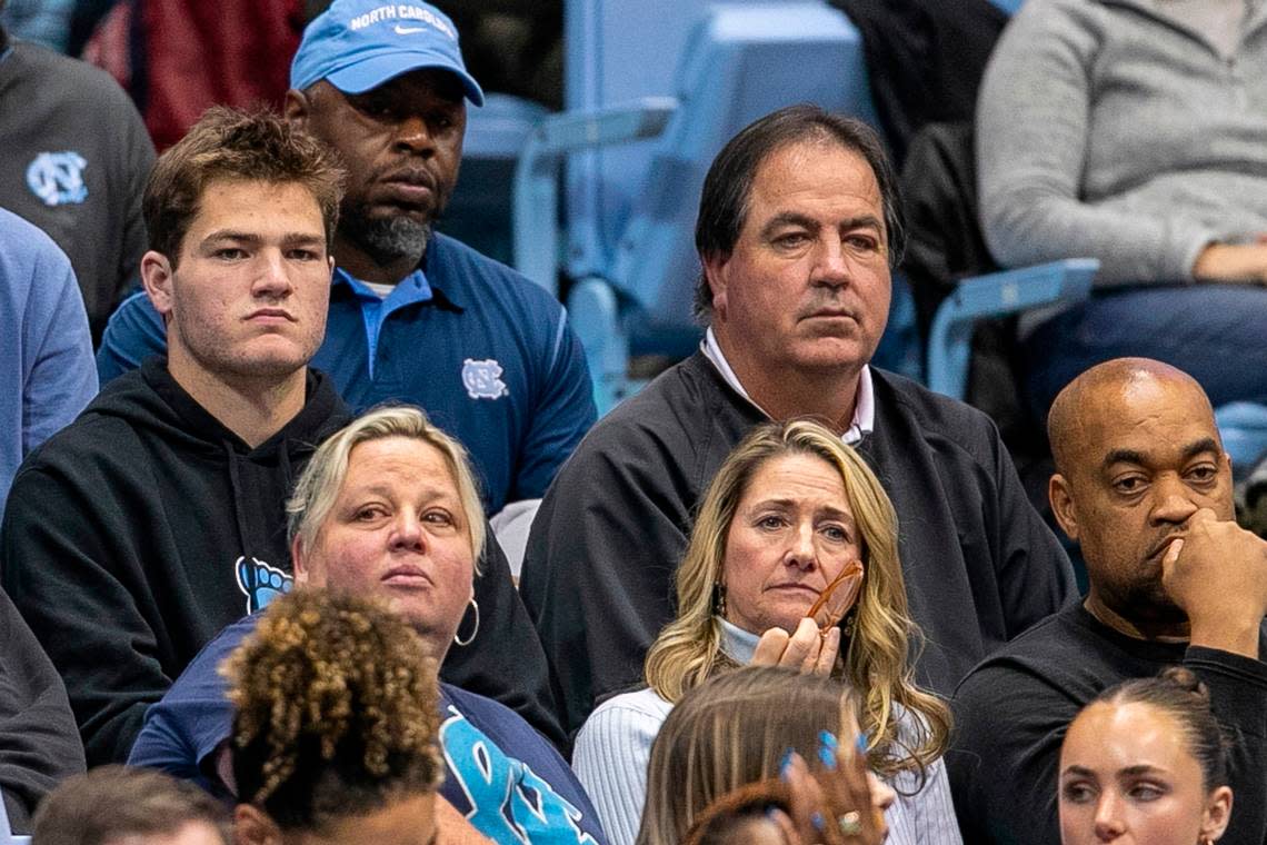 North Carolina quarterback Drake Maye and his father Mark Maye watch the second half of the Tar Heels’ basketball game against Gardner-Webb on Tuesday, November 15, 2022 at the Smith Center in Chapel Hill, N.C.