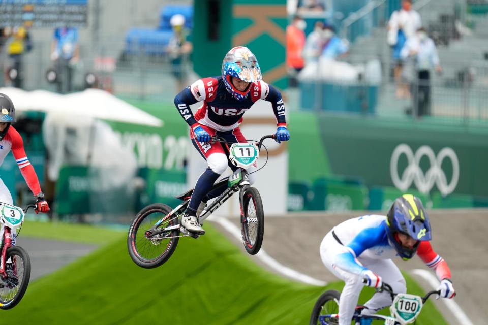 Connor Fields, center, races during the men's BMX semifinal race at the Tokyo Olympics.