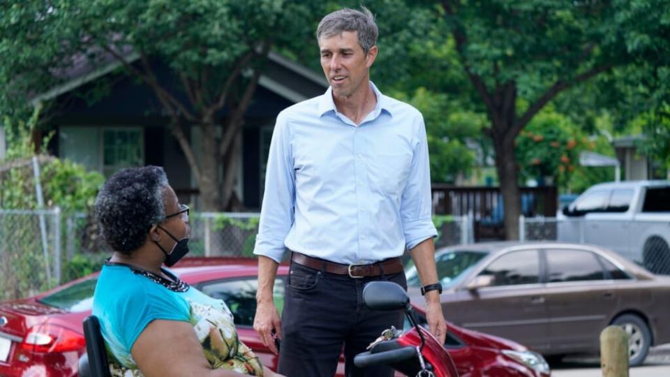 Beto O’Rourke talks to a voter in Dallas on June 9, 2021 during a canvassing effort. (Associated Press)