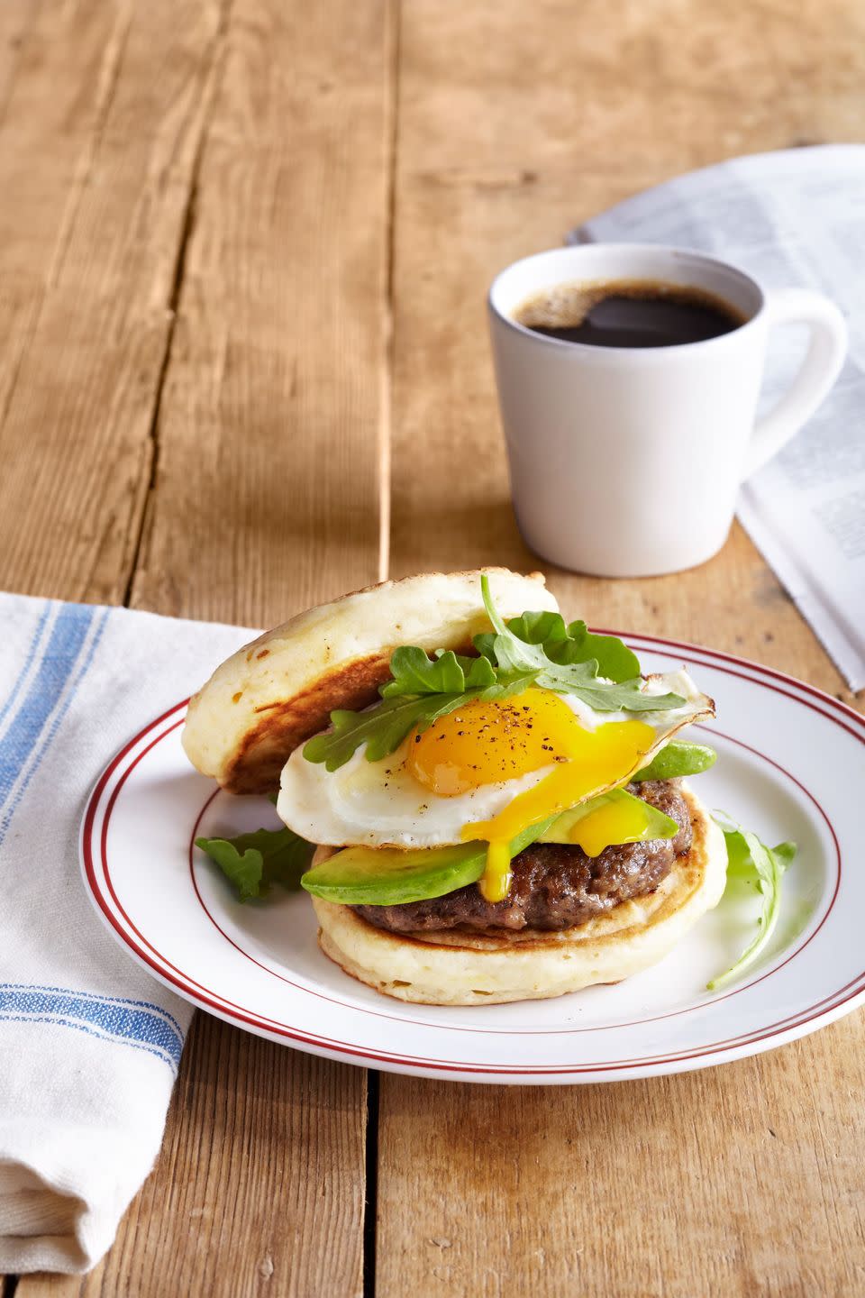 pancake breakfast sandwich with sausage and avocado