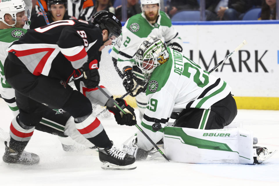 Buffalo Sabres left wing Eric Robinson (50) is stopped by Dallas Stars goaltender Jake Oettinger (29) during the first period of an NHL hockey game Tuesday, Feb. 6, 2024, in Buffalo, N.Y. (AP Photo/Jeffrey T. Barnes)