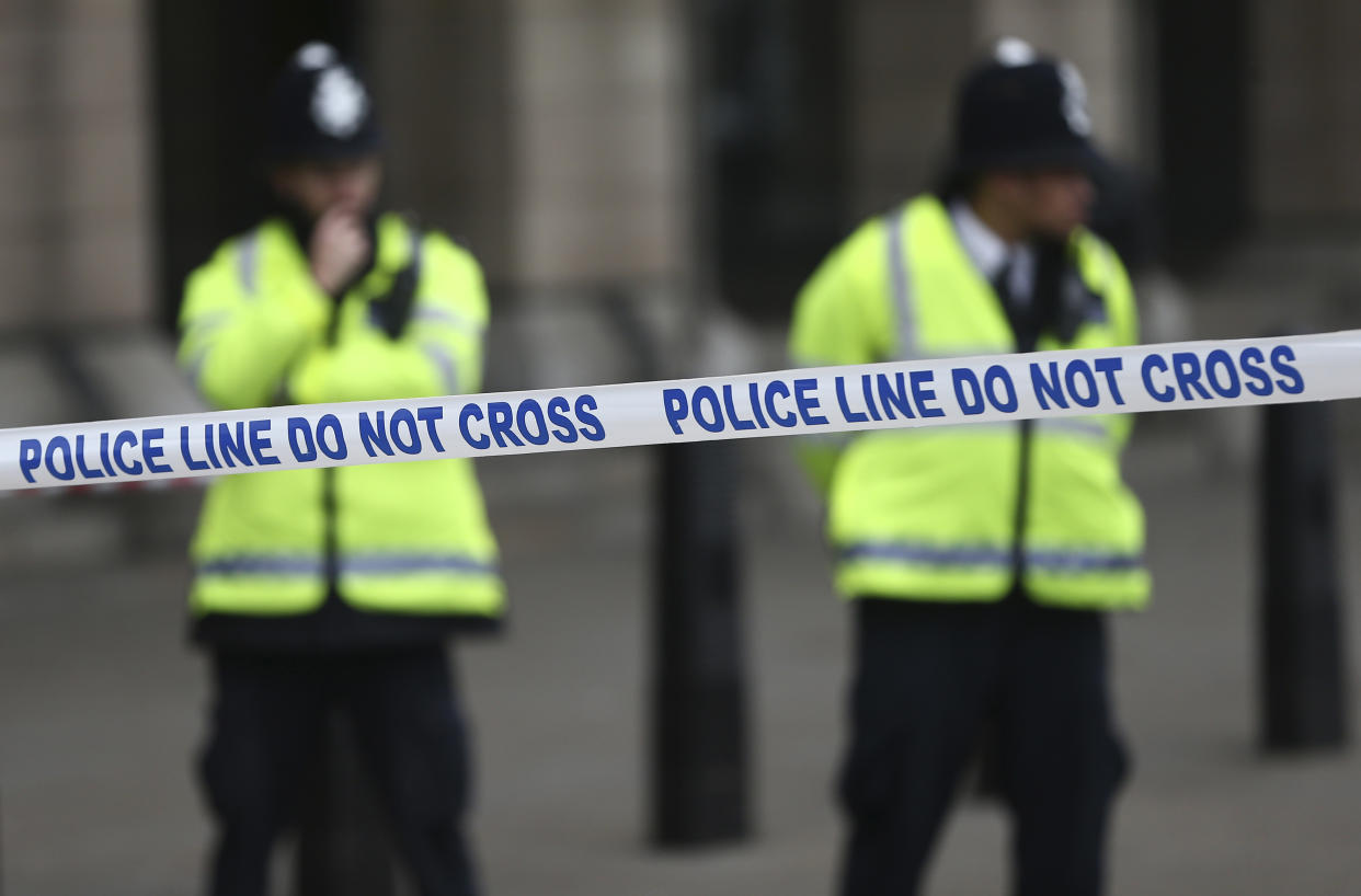 Police stand at a closed road which has been taped off in advance of New Year celebrations in London, Britain December 31, 2016. REUTERS/Neil Hall 