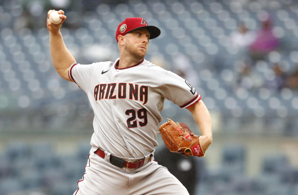 Arizona Diamondbacks starting pitcher Merrill Kelly (29) throws against the New York Yankees during the first inning of a baseball game, Monday, Sept. 25, 2023, in New York. (AP Photo/Noah K. Murray)