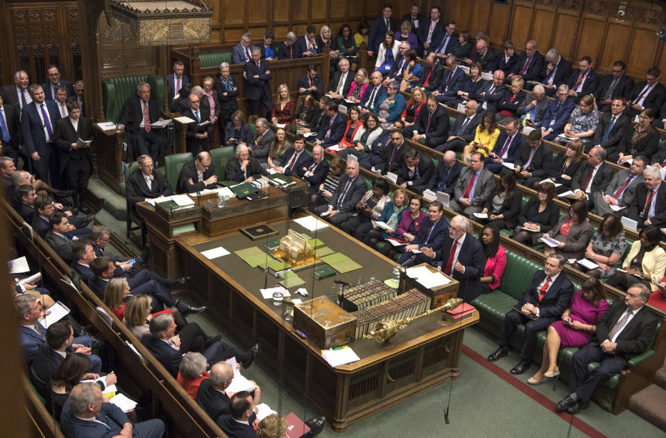 Britain's main opposition Labour Party leader Jeremy Corbyn, centre right, stands to talk to lawmakers inside parliament, London, Wednesday Feb. 27, 2019. Prime Minister Theresa May insisted Wednesday that Britain will leave the European Union on schedule next month, amid signs that her promise to give Parliament a vote on delaying Brexit was boosting support for her unpopular EU divorce deal. (Mark Duffy/UK Parliament via AP)