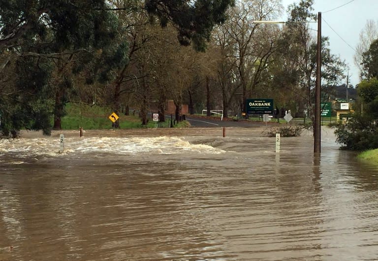 Flood water inundates roads following severe thunderstorms with destructive wind gusts of up to 140 kilometres per hour on the outskirts of Adelaide