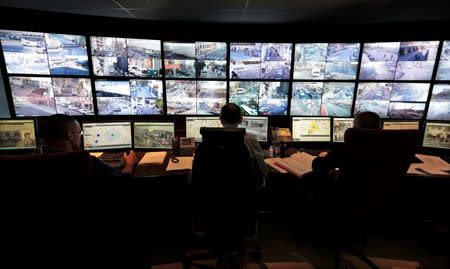 File photo of French municipal police officers who watch screens in the video surveillance control room of the municipal police supervision centre in Nice February 9, 2015. Picture taken February 9, 2015. REUTERS/Eric Gaillard/File Photo