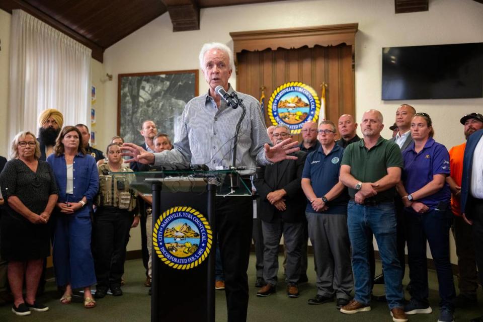 Marysville Mayor Chris Branscum talks to reporters after the city declared a state of emergency Friday, June 21, 2024. City officials declared the emergency in the hopes of freeing up state funds in the wake of the fire at the Hotel Marysville, a nearly-century-old structure downtown that could collapse.