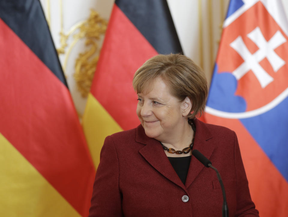 German Chancellor Angela Merkel smiles while addressing media at the V4+Germany summit in Bratislava, Slovakia, Thursday, Feb. 7, 2019. (AP Photo/Petr David Josek)