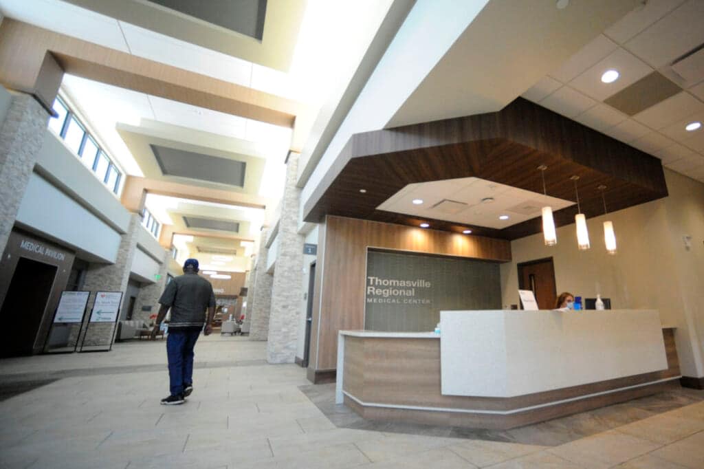 A man walks through the lobby of Thomasville Regional Medical Center in Thomasville, Ala., on Tuesday, May 3, 2022. (AP Photo/Jay Reeves)