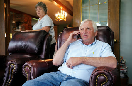 Farmer Ken Ries talks to one of his employees on the phone at his hog farm in Ryan, Iowa, U.S., May 18, 2019. Picture taken May 18, 2019. REUTERS/Ben Brewer