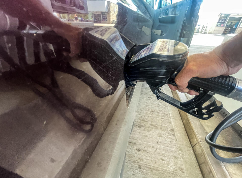 PENZANCE, UNITED KINGDOM - AUGUST 12: A man holds a fuel pump nozzle as he refuels a van with diesel at a fuel station at a branch of the supermarket retailer Sainsbury's on August 12, 2022 in Penzance, England. The British retailer, founded in 1869, is one of the largest market leaders of groceries in the UK. (Photo by Matt Cardy/Getty Images)