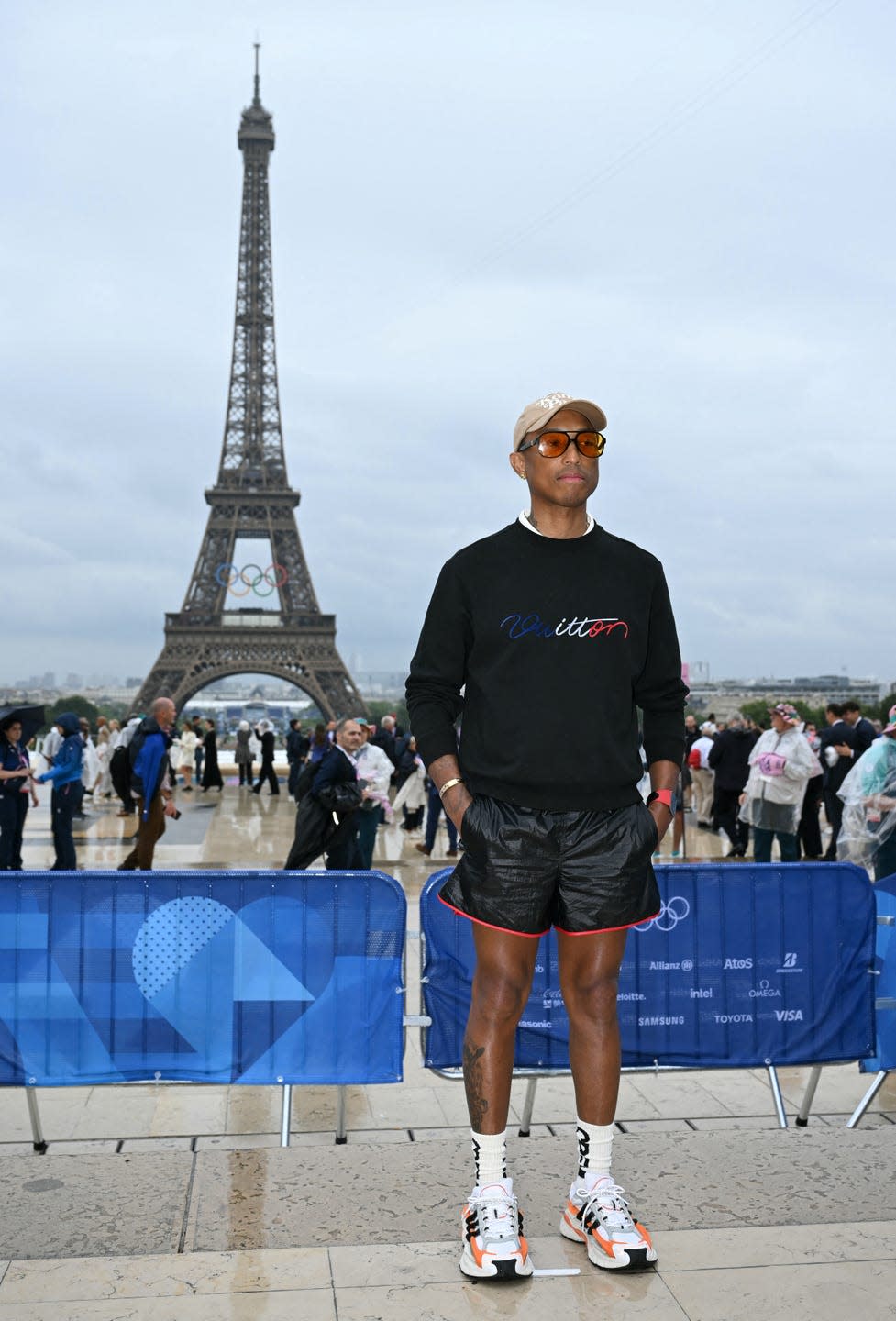 hip hop mogul pharrell williams arrives ahead of the opening ceremony of the paris 2024 olympic games in paris on july 26, 2024, as the eiffel tower is seen in the background photo by jonathan nackstrand afp photo by jonathan nackstrandafp via getty images