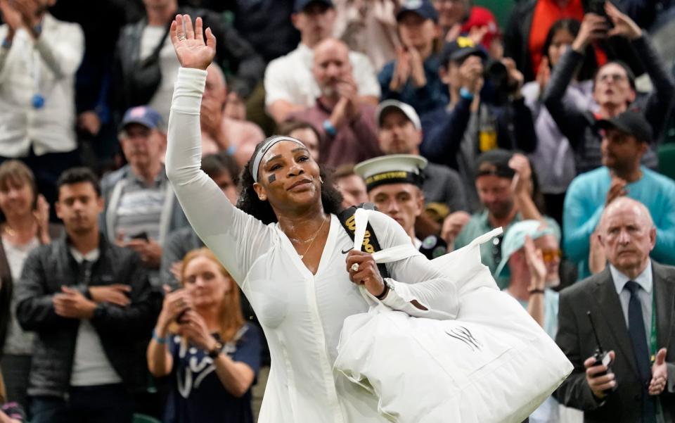 Serena Williams of the US waves as she leaves the court after losing to France's Harmony Tan in a first round women's singles match on day two of the Wimbledon tennis championships in London, Tuesday, June 28, 2022.  - AP