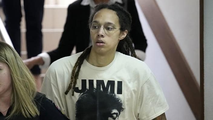 WNBA star and two-time Olympic gold medalist Brittney Griner is escorted to a courtroom for a hearing in Khimki just outside Moscow, Russia on Friday, where she was set to go on trial. (Photo: Alexander Zemlianichenko/AP)