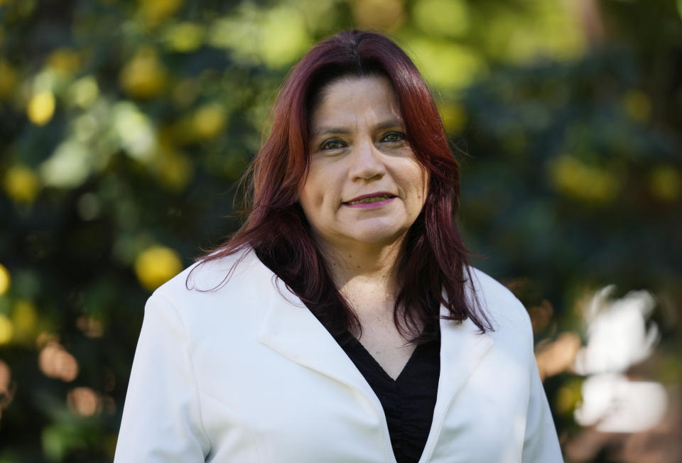 Journalist Claudia Julieta Duque poses for a portrait in Bogota, Colombia, Friday, July 29, 2022. Colombia has for a decade been quietly installing trackers in the armored vehicles of at-risk individuals as well as VIPs, including presidents, government ministers, senators, and Duque herself. (AP Photo/Fernando Vergara)