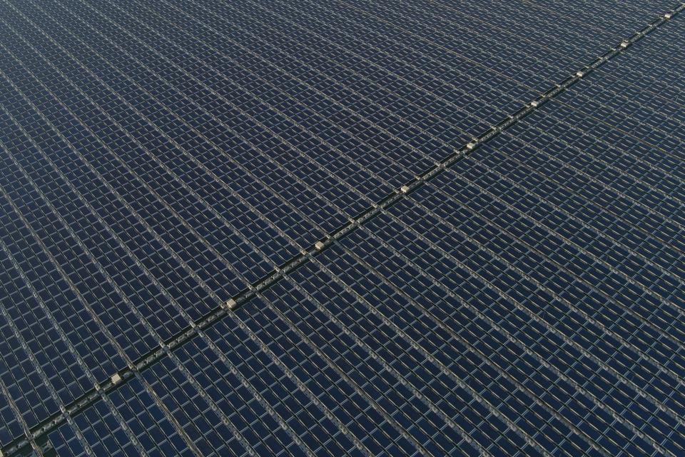 Rows of floating solar panels work on May 3, 2023, in Selangor, Malaysia. Floating solar panel farms are beginning to boom in the United States after rapid growth in Asia. They're attractive not just for their clean power and lack of a land footprint, but because they also conserve water by preventing evaporation. (AP Photo/Vincent Thian)