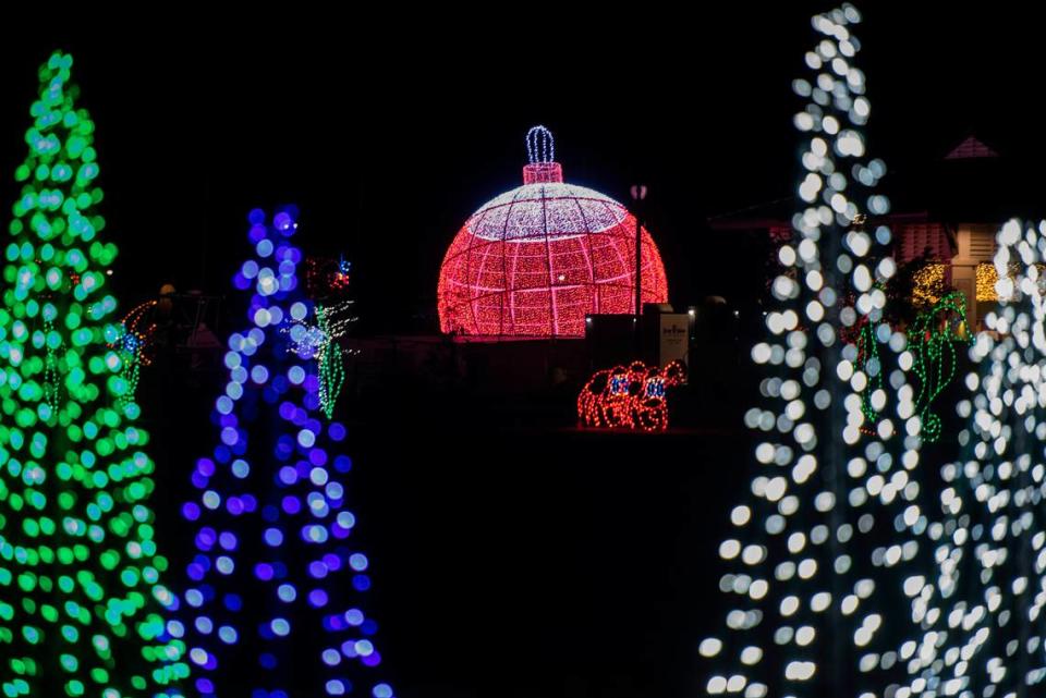 A giant ornament is illuminated during the Harbor Lights Winter Festival at Jones Park in Gulfport on Thursday, Dec. 2, 2021.