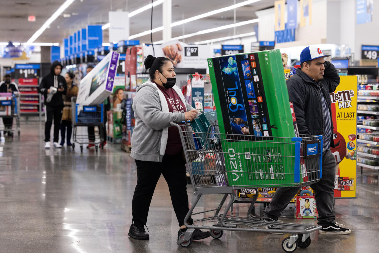 Shoppers pick up Vizio televisions and other Black Friday deals at a Walmart on November 25, 2022, in Dunwoody, Georgia. (Jessica McGowan/Getty Images)