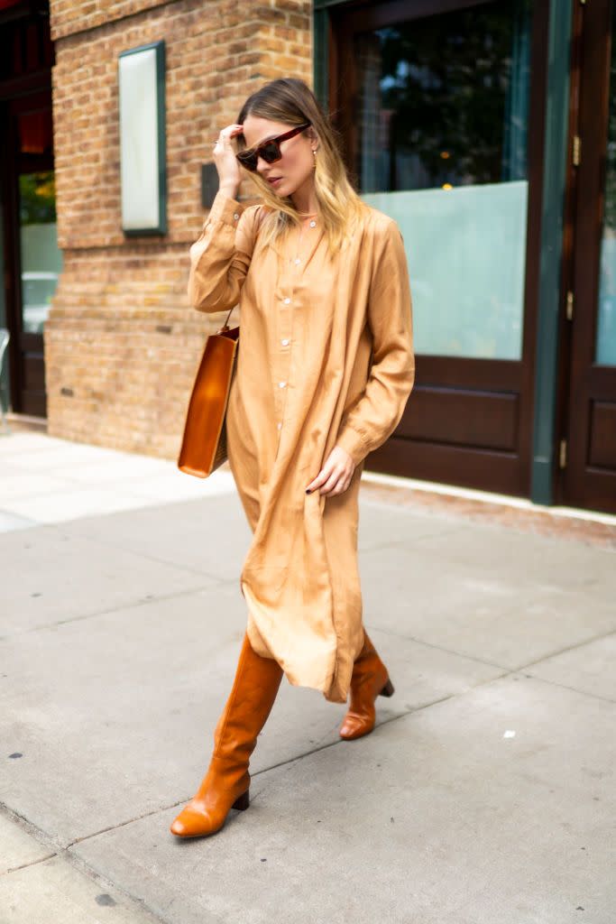 <p>The 29-year-old opted for a biscuit-hued ensemble whilst out in New York, with matching tan boots and bag and a sand-coloured dress by MILLE.</p><p>MILLE, Jasmine Dress in Almond, £188</p><p><a class="link " href="https://shopmille.com/collections/new-arrivals/products/jasmine-dress-in-almond" rel="nofollow noopener" target="_blank" data-ylk="slk:SHOP NOW;elm:context_link;itc:0;sec:content-canvas">SHOP NOW</a></p>