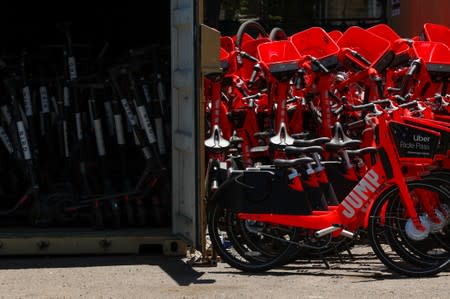 BIRD scooters and JUMP bikes are shown impounded at Scoot Scoop after being removed from private property in San Diego, California