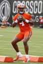 Cleveland Browns quarterback Deshaun Watson runs through a drill during NFL football practice at the team's training facility Wednesday, May 25, 2022, in Berea, Ohio. (AP Photo/Ron Schwane)