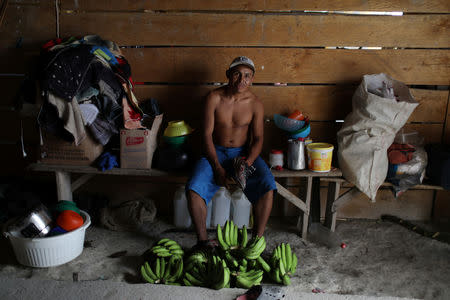 FILE PHOTO: Venezuelan indigenous Nestor Montiel of Pemon tribe pose for a portrait in the Brazilian indigenous village Tarau Paru in the border city of Pacaraima, Brazil April 14, 2019. REUTERS/Pilar Olivares
