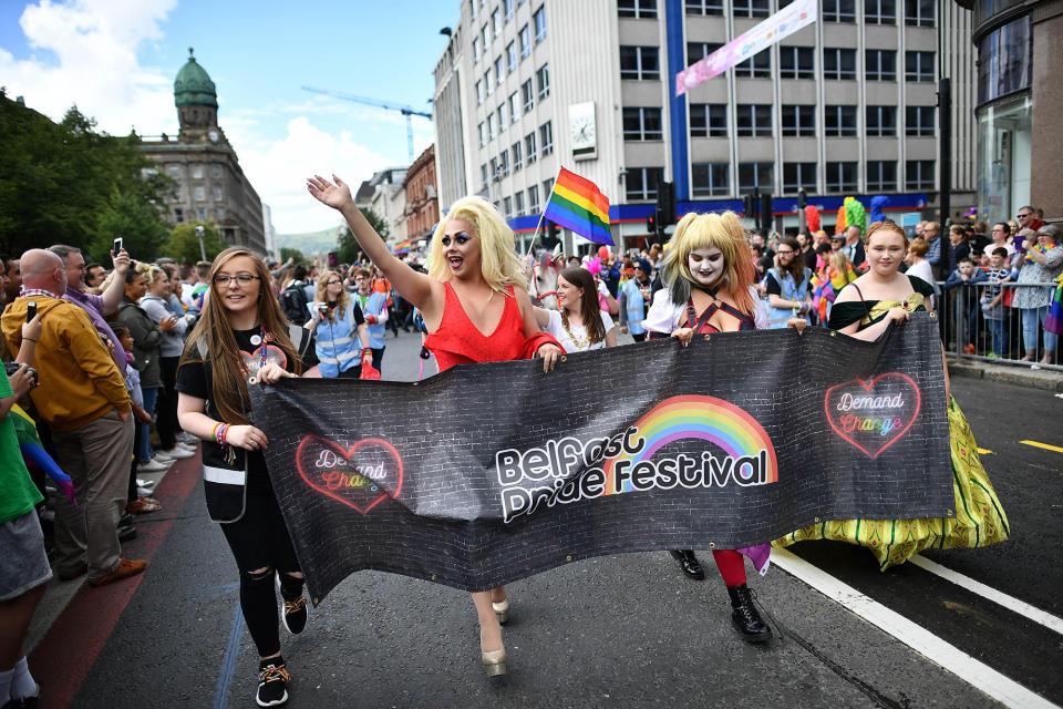 <p>Participants wave to the large crowd of spectators as Belfast Gay Pride takes place on Aug. 5, 2017 in Belfast, Northern Ireland. (Photo: Charles McQuillan/Getty Images) </p>