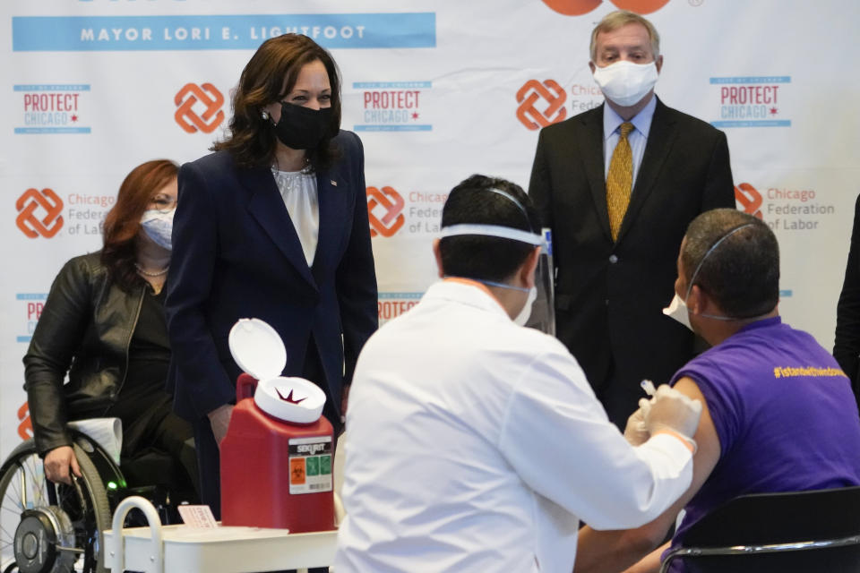 Vice President Kamala Harris talks with Lucio Polanco, a high-rise window washer, as he gets the Johnson & Johnson COVID-19 vaccination from Osman Meah at COVID-19 vaccination site, Tuesday, April 6, 2021, in Chicago. Watching are Sen. Tammy Duckworth, D-Ill., left, and Sen. Dick Durbin, D-Ill. The site is a partnership between the City of Chicago and the Chicago Federation of Labor. (AP Photo/Jacquelyn Martin)