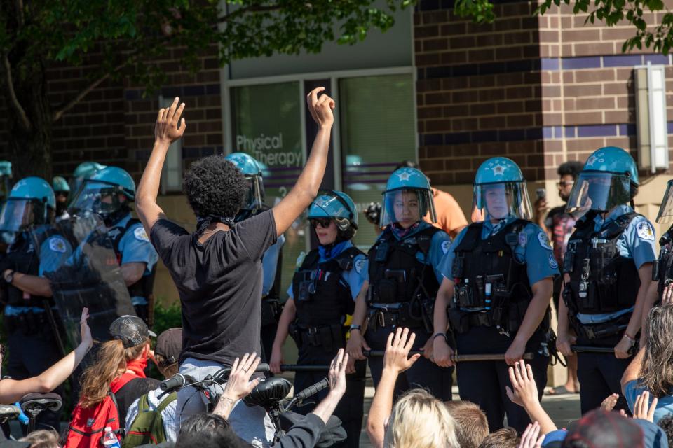 Protestors stage a peaceful sit-in outside the Chicago Police 18th district station demanding equality in police protection across the city on June 1, 2020.