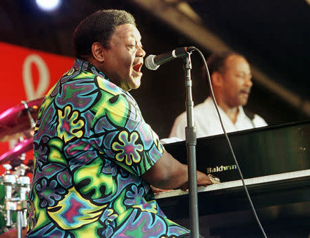 FILE PHOTO - New Orleans rhythm and blues legend Fats Domino performs at the 30th Annual New Orleans Jazz and Heritage Festival April 25, 1999. REUTERS/Lee Celano/File Photo