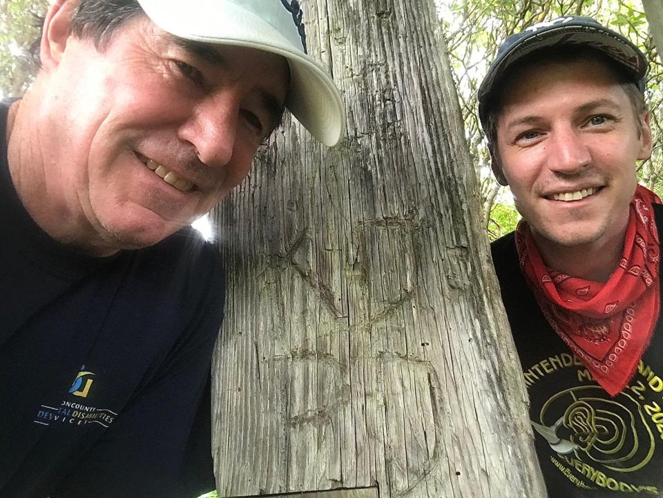 Enquirer columnist Paul Daugherty and his son, Kelly, on a hiking trail leading to Looking Glass Rock in Asheville, North Carolina.