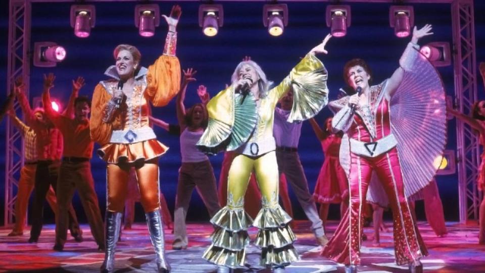 Louis Pitre, center, as Donna with Karen Mason, left, and Judy Kaye in “Mamma Mia” at Broadway’s Winter Garden Theatre. Tina Maddigan Mayer, now of Overland Park, played Sophie in the production.