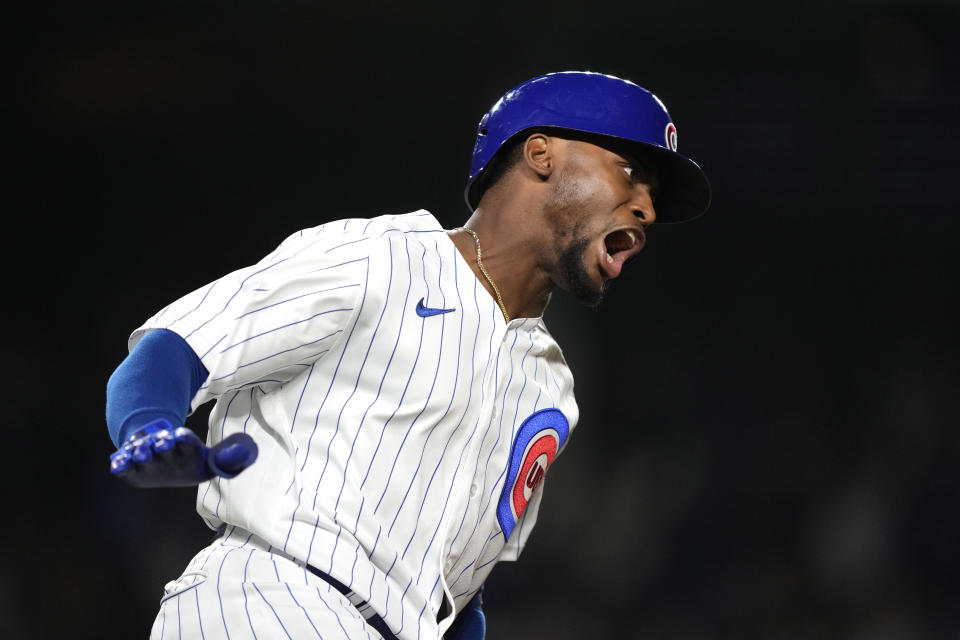 Chicago Cubs' Alexander Canario reacts to his grand slam off Pittsburgh Pirates relief pitcher Kyle Nicolas during the eighth inning of a baseball game Tuesday, Sept. 19, 2023, in Chicago. (AP Photo/Charles Rex Arbogast)