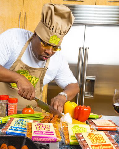 <p>Phil Emerson</p> E-40 slices up meat for a 'Goon with the Spoon' photoshoot