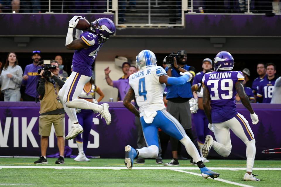 Vikings safety Josh Metellus intercepts a pass intended for Lions wide receiver DJ Chark during the fourth quarter Sunday, Sept. 25, 2022, in Minneapolis. The Vikings won, 28-24.