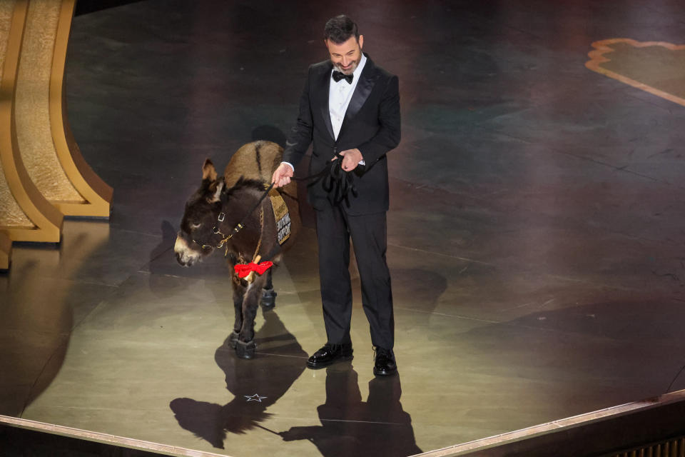 HOLLYWOOD, CA - MARCH 12: Host Jimmy Kimmel appears onstage with a donkey at the 95th Academy Awards in the Dolby Theatre on March 12, 2023 in Hollywood, California. (Myung J. Chun / Los Angeles Times via Getty Images)