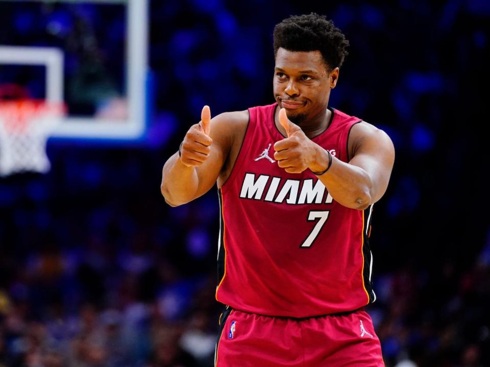 Kyle Lowry holds two thumbs up during a game.