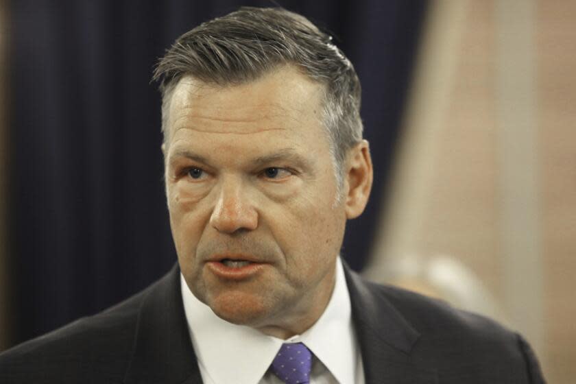 Kansas Attorney General Kris Kobach answers questions during a news conference about a new state law that defines male and female in state law so that transgender people can't change their driver's licenses and birth certificates to reflect their gender identities, Monday, June 26, 2023, at the Statehouse in Topeka, Kansas. The number of people making those changes jumped more than 300% this year ahead of the new law taking effect. (AP Photo/John Hanna)