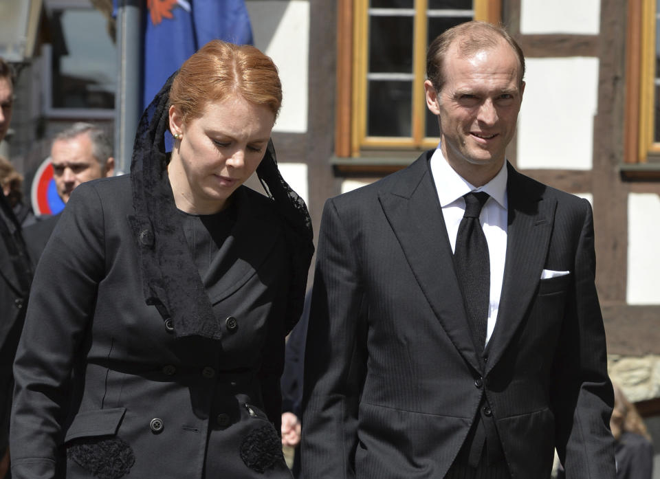 FILE - In this June 3, 2013 file photo Prince Henry Donatus of Hesse, Landgrave of Hesse, and his wife Floria-Franziska walk outside the Lutheran town church of St. John in Kronberg on their way to the funeral service for his father, Moritz Landgrave of Hesse. Prince Henry Donatus will attend Britain's Prince Philip's funeral at St. George's Chapel at Windsor Palace on Saturday. (Arne Dedert/DPA via AP)