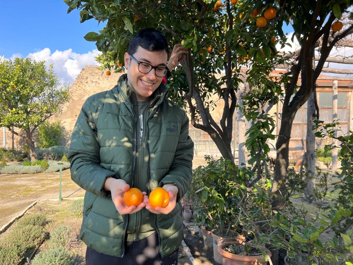 Mattia, one of the young men with autism who help tend the garden of Casa Pansa at the Archaeological Park of Pompeii. Pompeii is working to widen inclusion, both of who comes to the site and the stories it tells of the past. (Megan Williams - image credit)