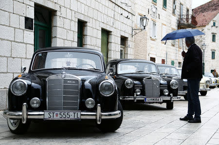 A man looks at old-timer Mercedes cars in Imotski, Croatia, May 19, 2019. REUTERS/Antonio Bronic