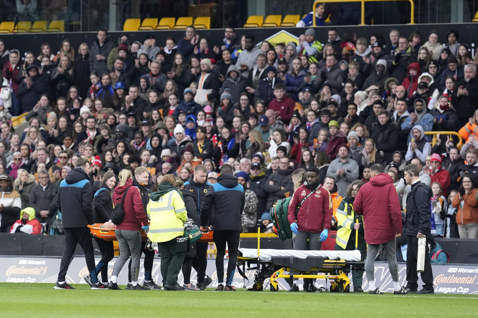 Arsenal's Frida Maanum leaves the pitch on a stretcher after receiving treatment from the medical staff during the FA Women's Continental Tyres League Cup Final at Molineux Stadium, Wolverhampton, England, Sunday March 31, 2024. (Nick Potts/PA via AP)