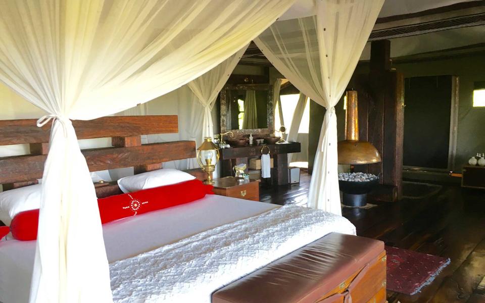 <p>Guestrooms at Zarafa have a distinct <em>Out of Africa</em> vibe, albeit one with unparalleled luxury (the camp is a favorite among Hollywood celebs). Rooms are completely tented but have high-tech amenities like cooling systems inside the canopy beds for hot summer nights and a brass-covered automatic coal heater for winter.</p>